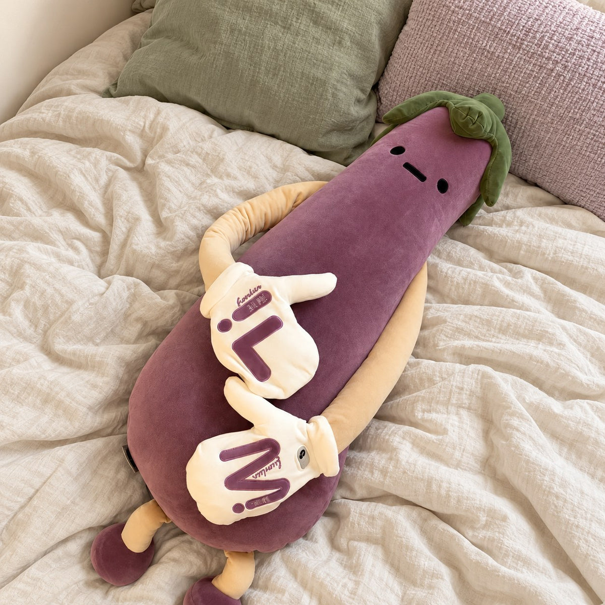 Eddie the Eggplant lying on a cozy bed