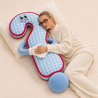 Woman cuddling Milo the Mystery on a bed